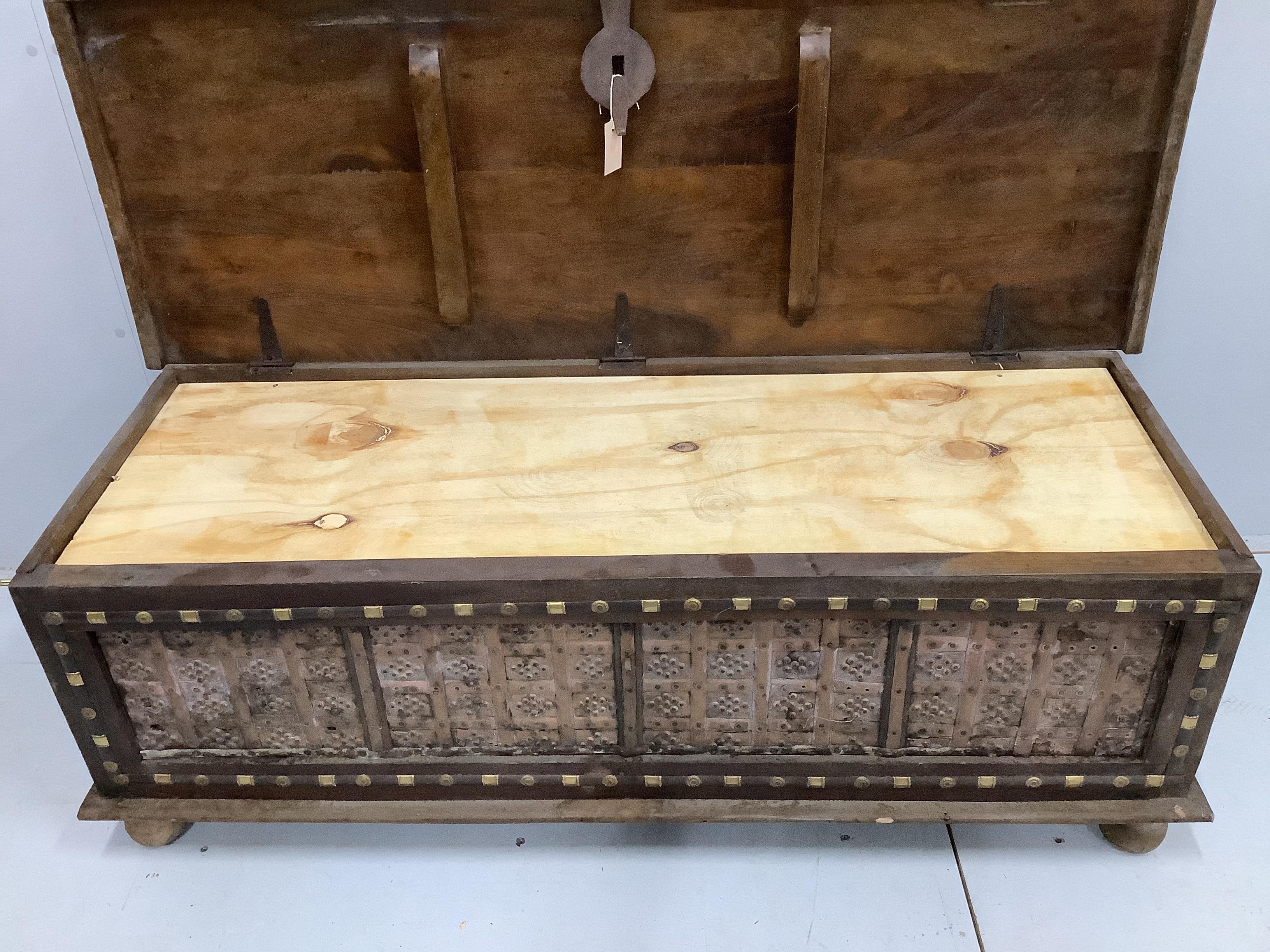 A Zanzibar style brass mounted hardwood coffer, width 145cm, depth 55cm, height 49cm
